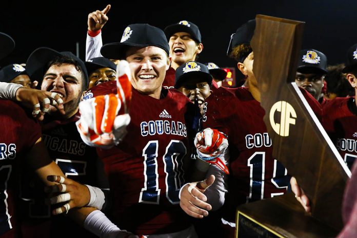 Steele Canyon's Tanner Ewert (10) celebrates after defeating Half Moon Bay 44-42 to win the Division 3-A state title.