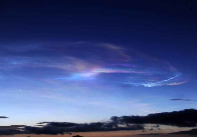 Missile test launch from submarine lights up evening sky