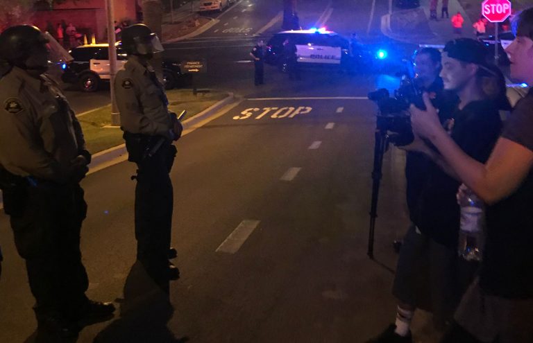 Heavy police presence awaits  public outside council meeting