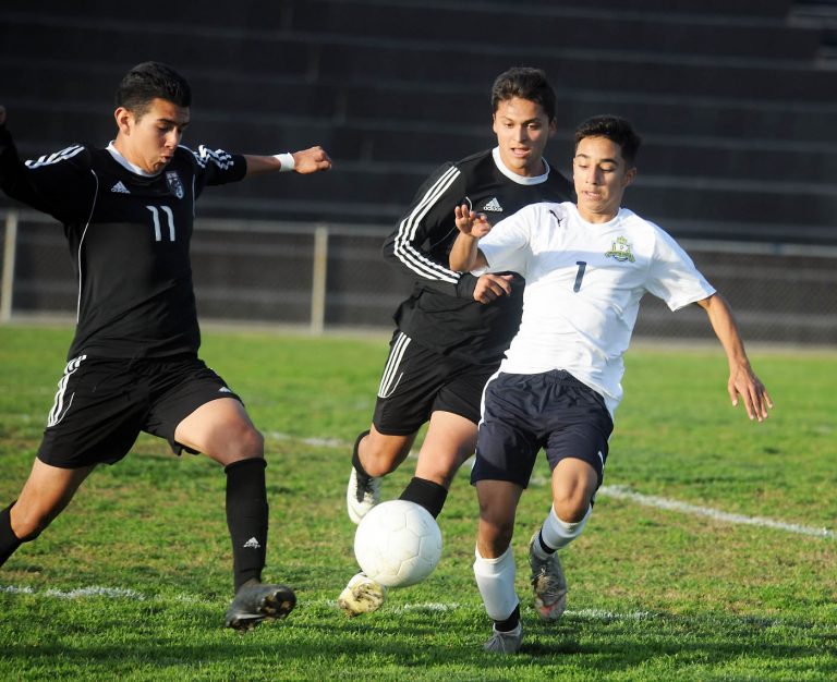 Trojan boys soccer team hit with forfeits, hit Barons with loss