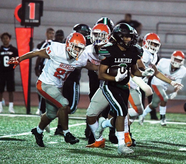 Lancers rush past Norsemen, 27-13, to remain undefeated on season