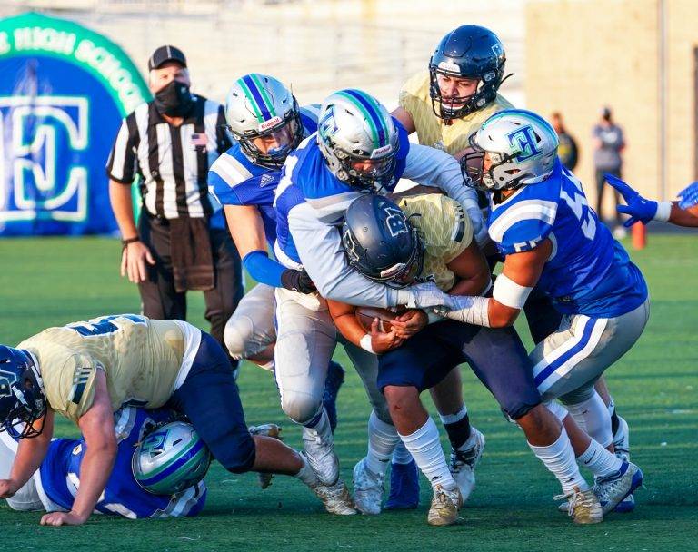 Titans ‘boot’ Barons, 55-3, in rivalry game