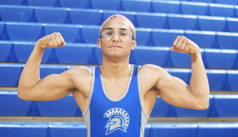 Olympian mat men climb to top of Metro boys wrestling tournament standings