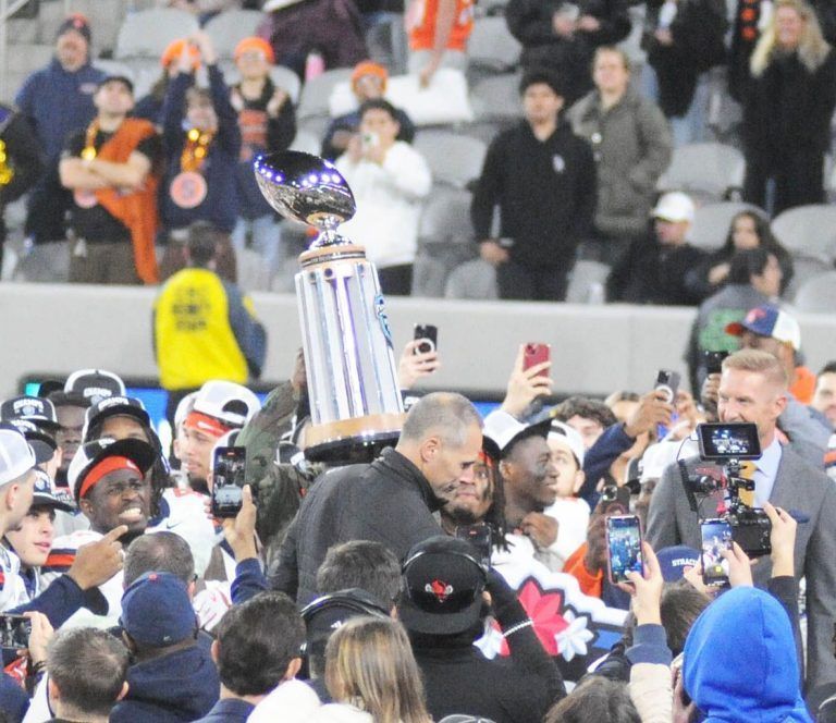 College football season hits high note with big bucks, title game